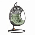 Hanging egg chair with cushioned seat and metal frame for indoor outdoor use